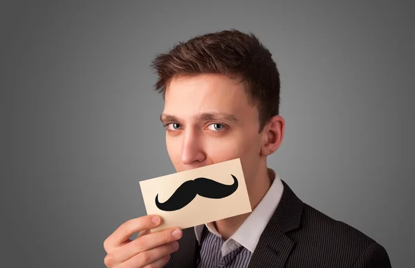 Gelukkig zakenman met grappige snor kaart op zijn mond — Stockfoto