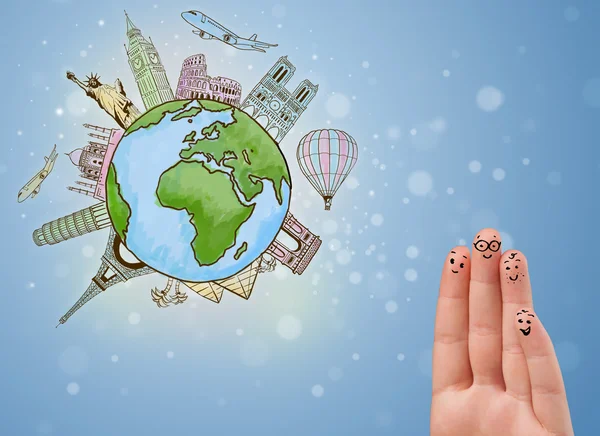 Cheerful finger smileys with famous landmarks of the globe — Stock Photo, Image