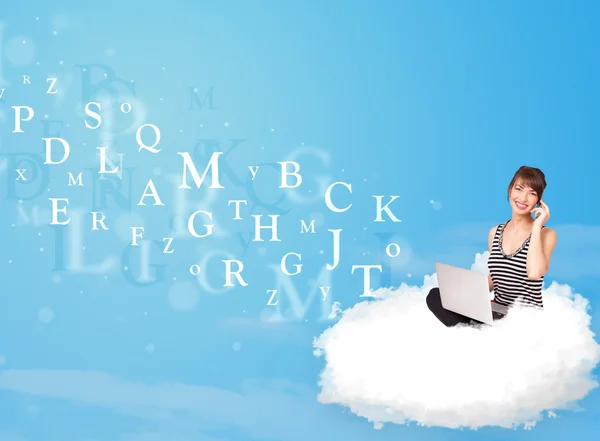 Young woman sitting in cloud with laptop — Stock Photo, Image