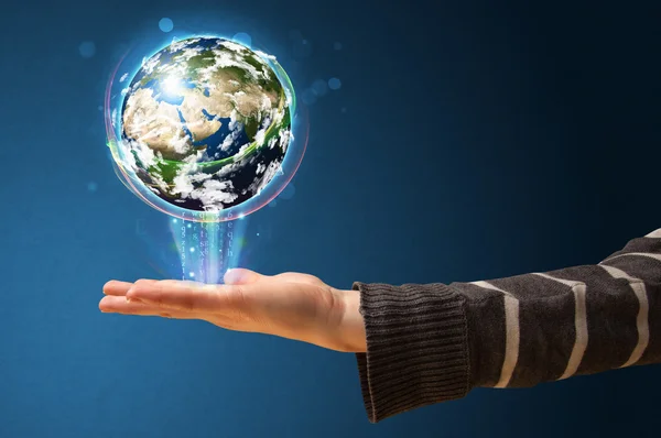 Woman holding a glowing earth globe — Stock Photo, Image