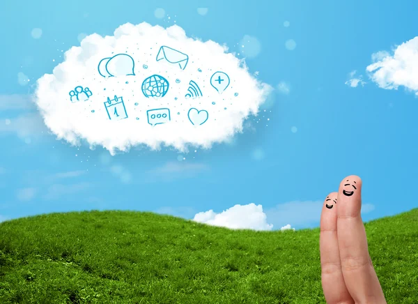 Happy smiley fingers looking at cloud with blue social icons and — Stock Photo, Image