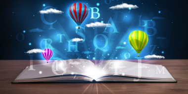 Parlayan fantezi bulutları ve balonları olan açık bir kitap
