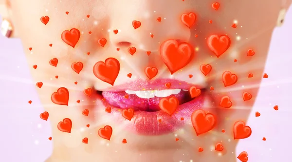 Pretty lady lips with lovely red hearts — Stock Photo, Image