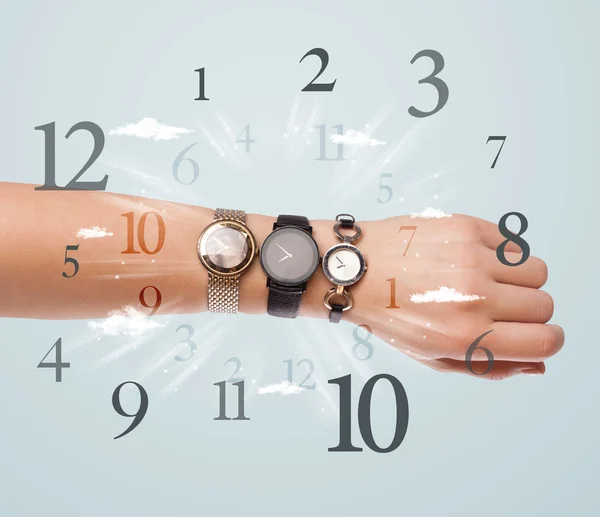 Hand with watch and numbers on the side comming out — Stok fotoğraf