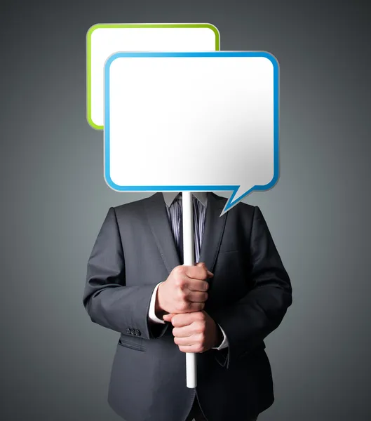 Businessman holding speech bubble — Stock Photo, Image