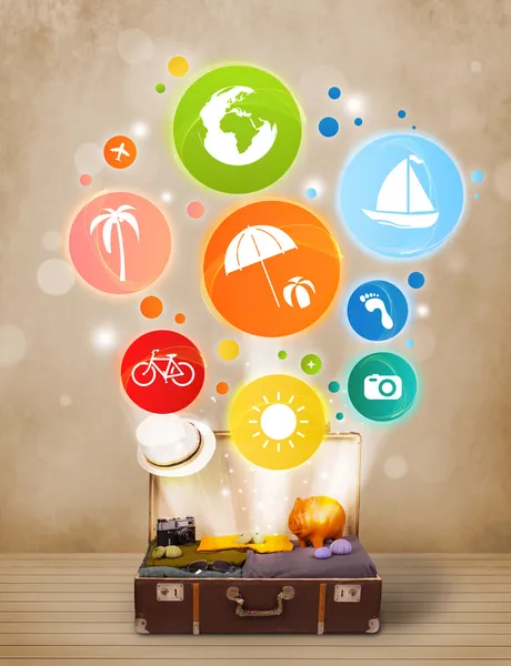 Suitcase with colorful summer icons and symbols — Stock Photo, Image