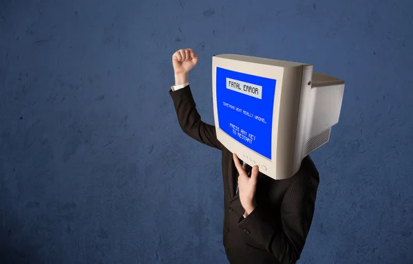 Person with a monitor head and fatal error blue screen on the di — Stock Photo, Image