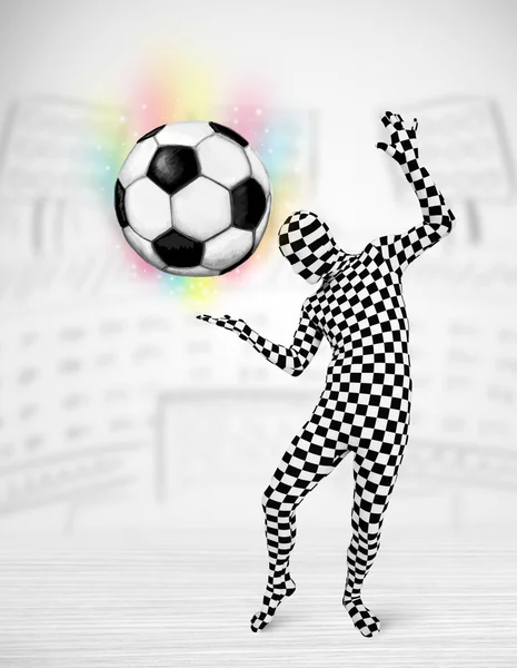 Man in full body suit holdig soccer ball — Stock Photo, Image