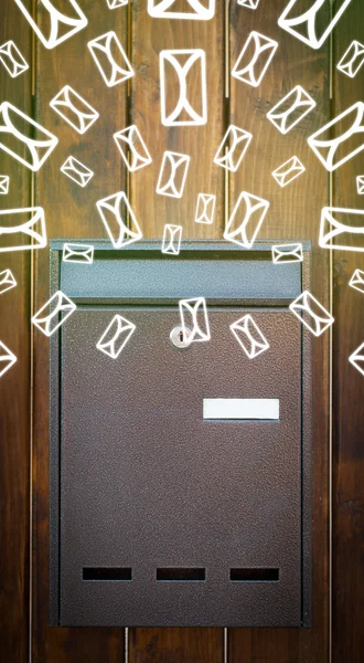 Mailbox with letter icons on glowing green background — Stock Photo, Image