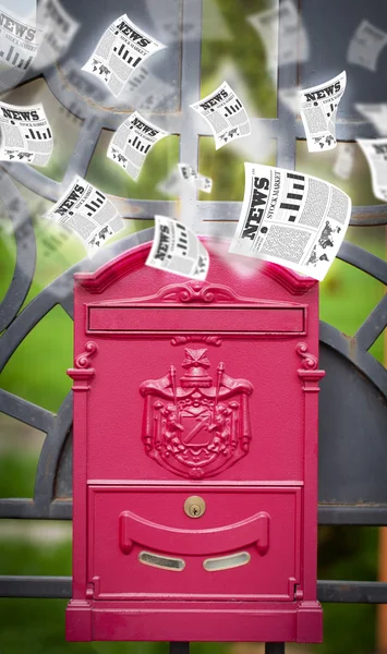 Post box with daily newspapers flying — Stock Photo, Image