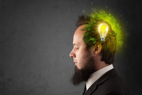 Young mind thinking of green eco energy with lightbulb — Stock Photo, Image