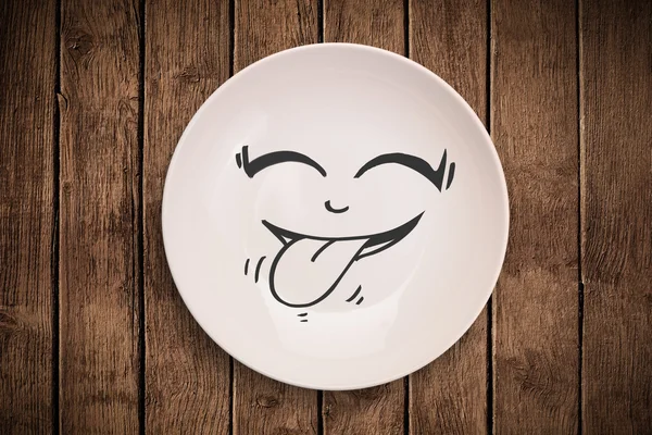 Happy hymiö sarjakuva kasvot värikäs lautasen — kuvapankkivalokuva