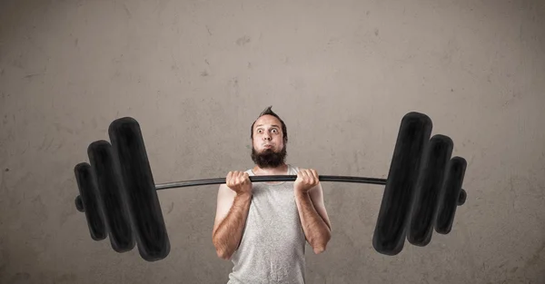 Funny skinny guy lifting weights — Stock Photo, Image