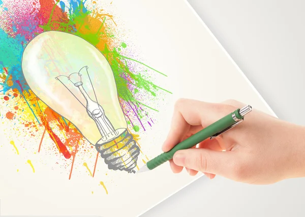 Hand drawing colorful idea light bulb with a pen — Stock Photo, Image