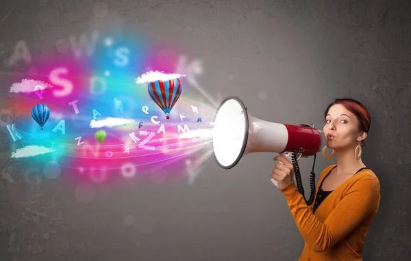 Girl shouting into megaphone and abstract text and balloons come — Stock Photo, Image