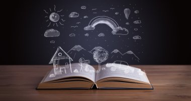 Elle çizilmiş peyzaj ile açık kitap
