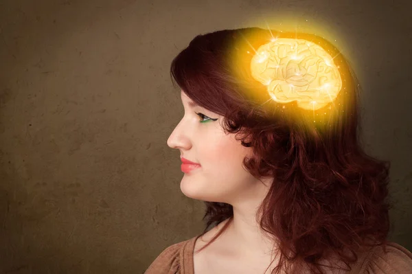 Young girl thinking with glowing brain illustration — Stock Photo, Image