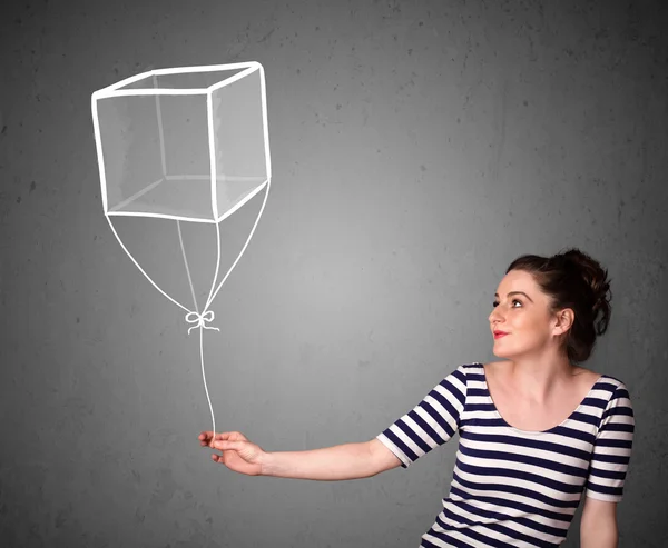 Donna in possesso di un palloncino cubo — Foto Stock