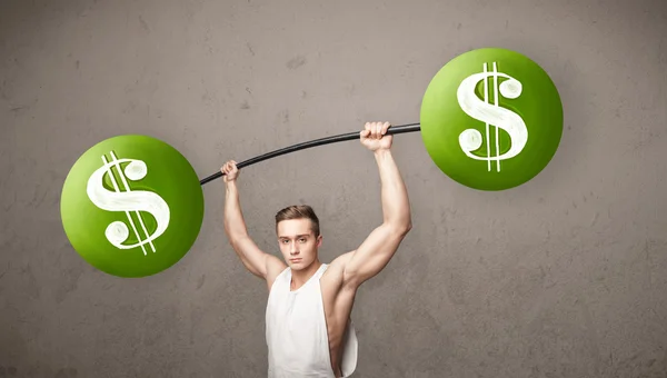 Muscular man lifting green dollar sign weights — Stock Photo, Image