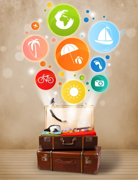 Suitcase with colorful summer icons and symbols — Stock Photo, Image