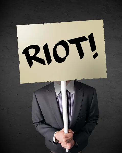 Businessman holding a protest sign — Stock Photo, Image