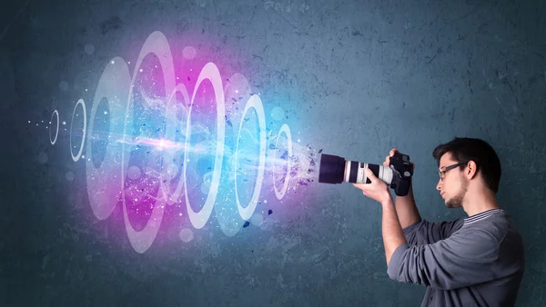 Photographer making photos with powerful light beam — Stock Photo, Image