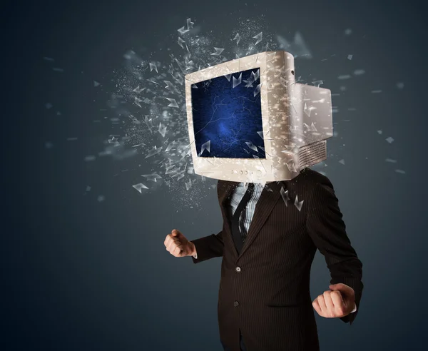 Computer monitor screen exploding on a young persons head — Stock Photo, Image