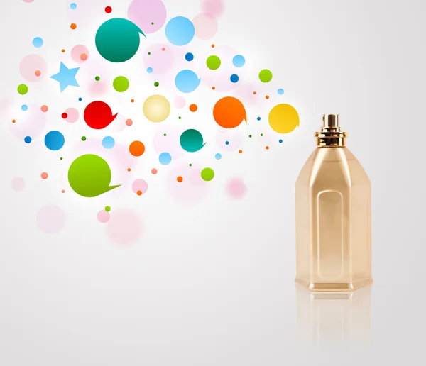 Perfume bottle spraying colored bubbles — Stock Photo, Image