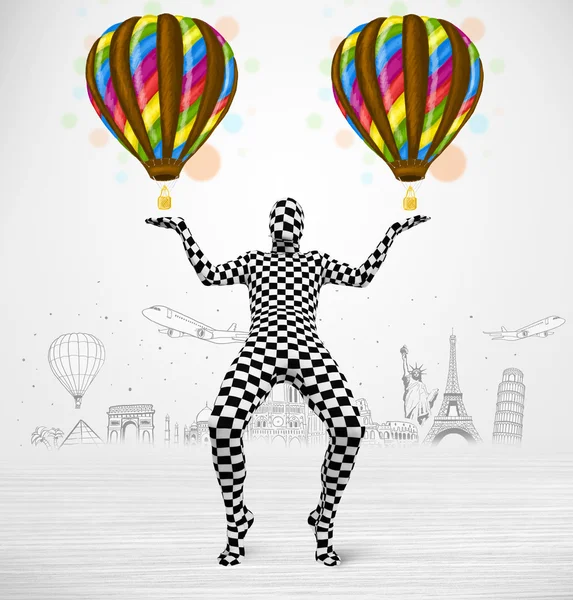 Man in full body suit holding balloon — Stock Photo, Image