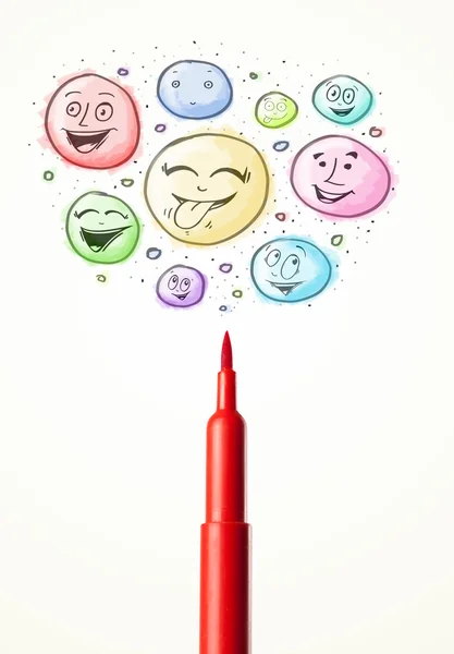 Smiley faces coming out of felt pen — Stock Photo, Image