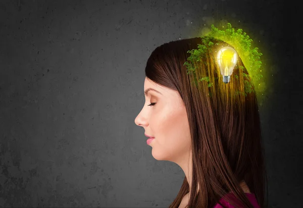 Young mind thinking of green eco energy with lightbulb — Stock Photo, Image