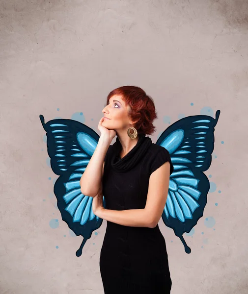 Young girl with butterfly blue illustration on the back — Stock Photo, Image