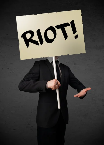 Businessman holding a protest sign — Stock Photo, Image