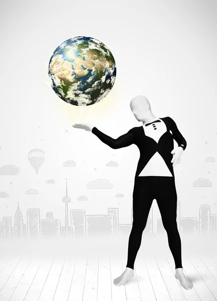 Man in full body suit holding planet earth — Stock Photo, Image