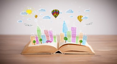 Açık kitap üzerine şehir manzarası çizimi