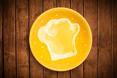 El çizimi beyaz şef sembollü renkli bir tabak.