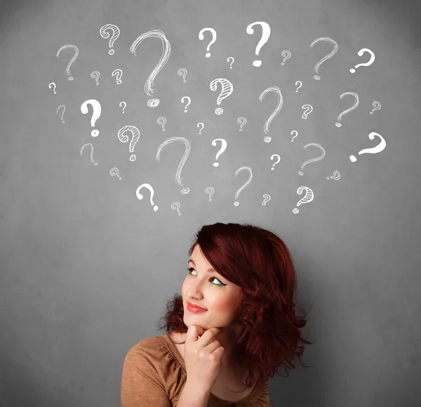 Young woman with question marks above her head — Stock Photo, Image