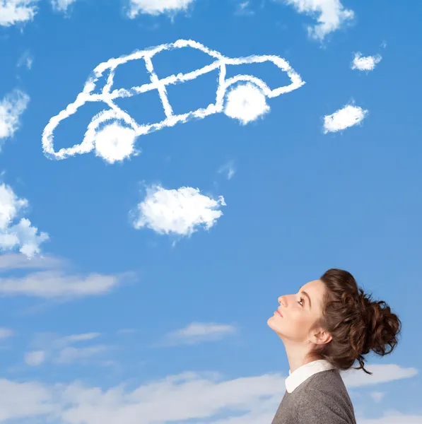 Young girl looking at car cloud on a blue sky — Stock Photo, Image