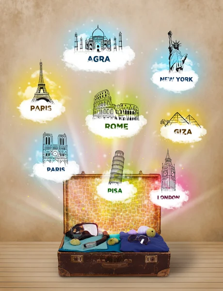 Tourist suitcase with famous landmarks around the world — Stock Photo, Image