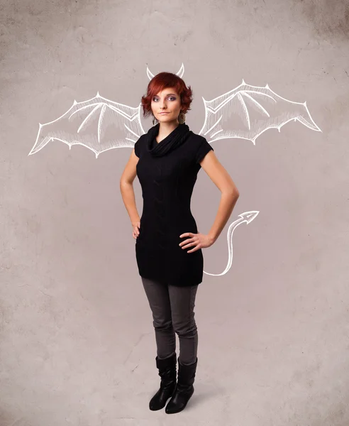 Young girl with devil horns and wings drawing — Stock Photo, Image