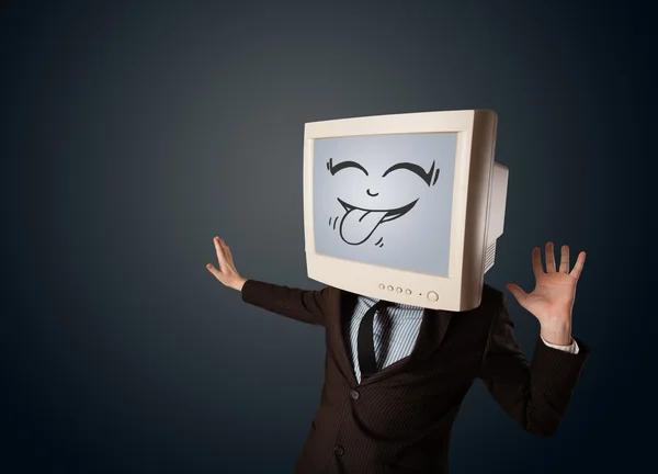Homem de negócios feliz com um monitor de computador e um rosto sorridente — Fotografia de Stock