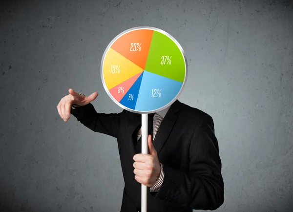 Businessman holding a pie chart — Stock Photo, Image