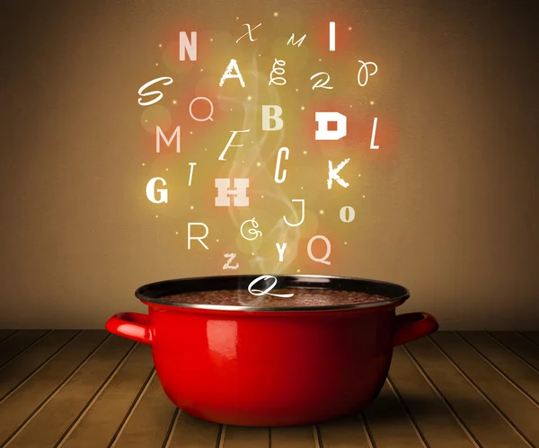 Glowing letters coming out from cooking pot — Stock Photo, Image