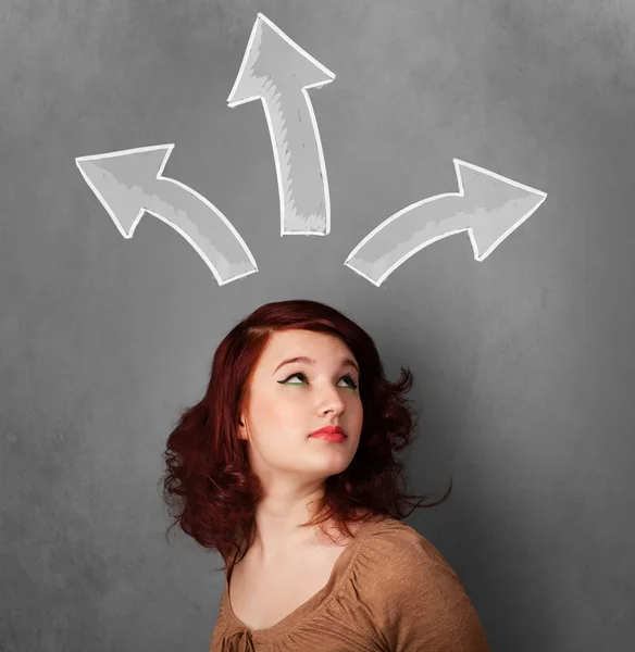 Young woman thinking with arrows above her head — Stock Photo, Image