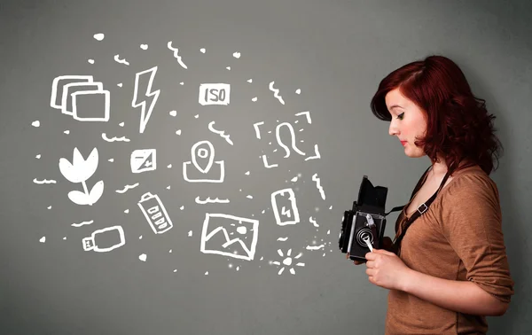 Menina fotógrafa captura de ícones e símbolos de fotografia branca — Fotografia de Stock