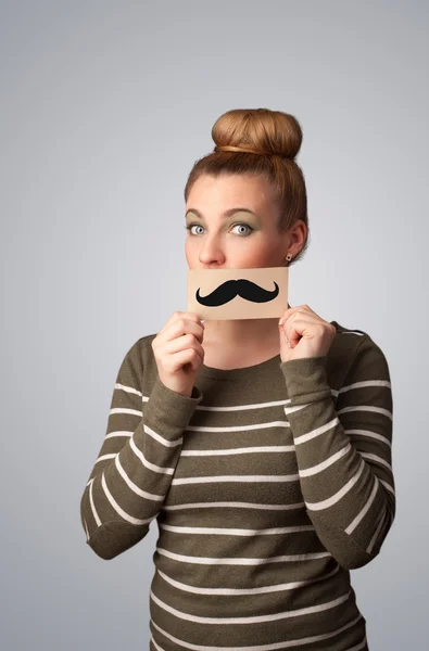Menina bonito feliz segurando papel com desenho de bigode — Fotografia de Stock