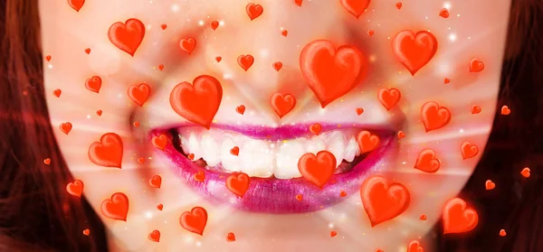 Pretty lady lips with lovely red hearts — Stock Photo, Image