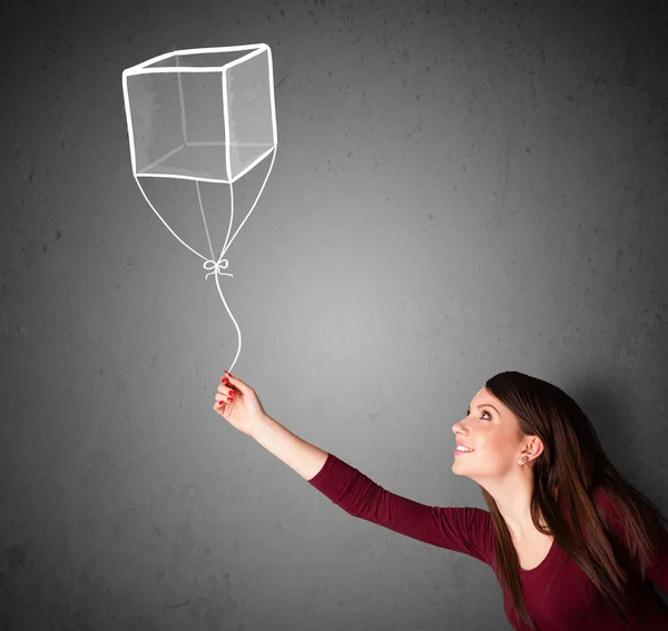 Woman holding a cube balloon — Stock Photo, Image