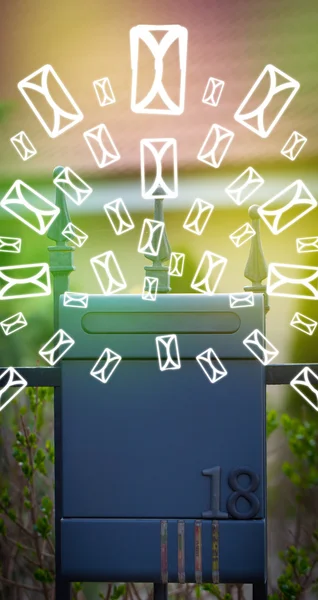 Mailbox with letter icons on glowing green background — Stock Photo, Image