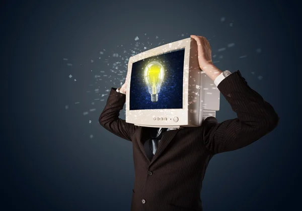 Business man with a pc monitor head and idea light bulb in the d — Stock Photo, Image